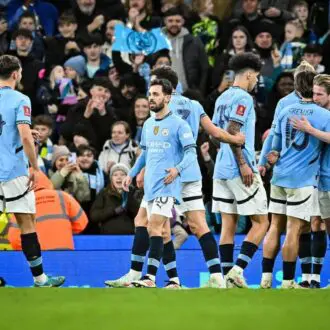 Manchester City players celebrating at Etihad Stadium, Manchester.