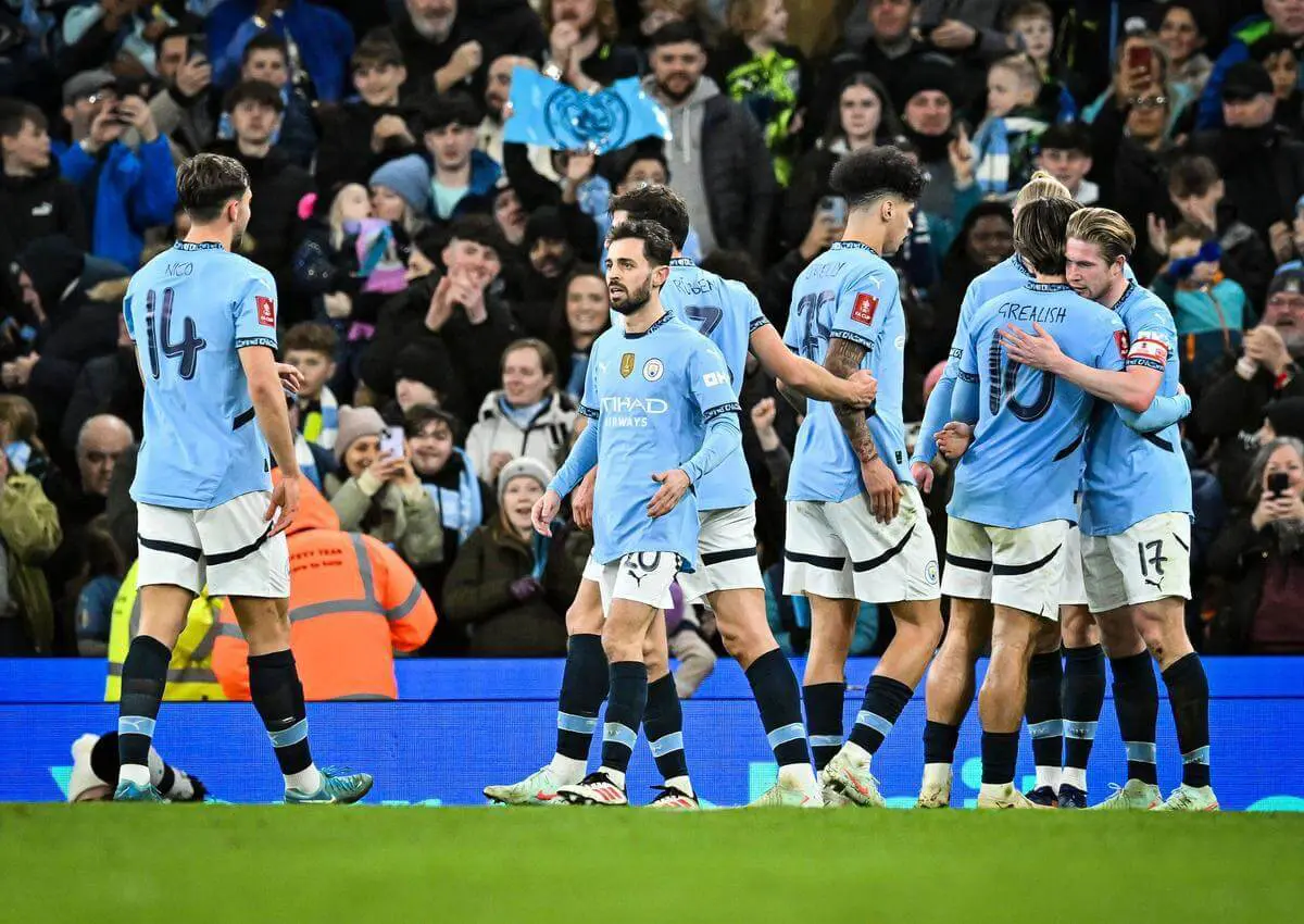 Manchester City players celebrating at Etihad Stadium, Manchester.