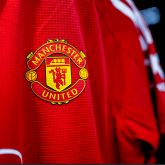 Manchester United shirt.
