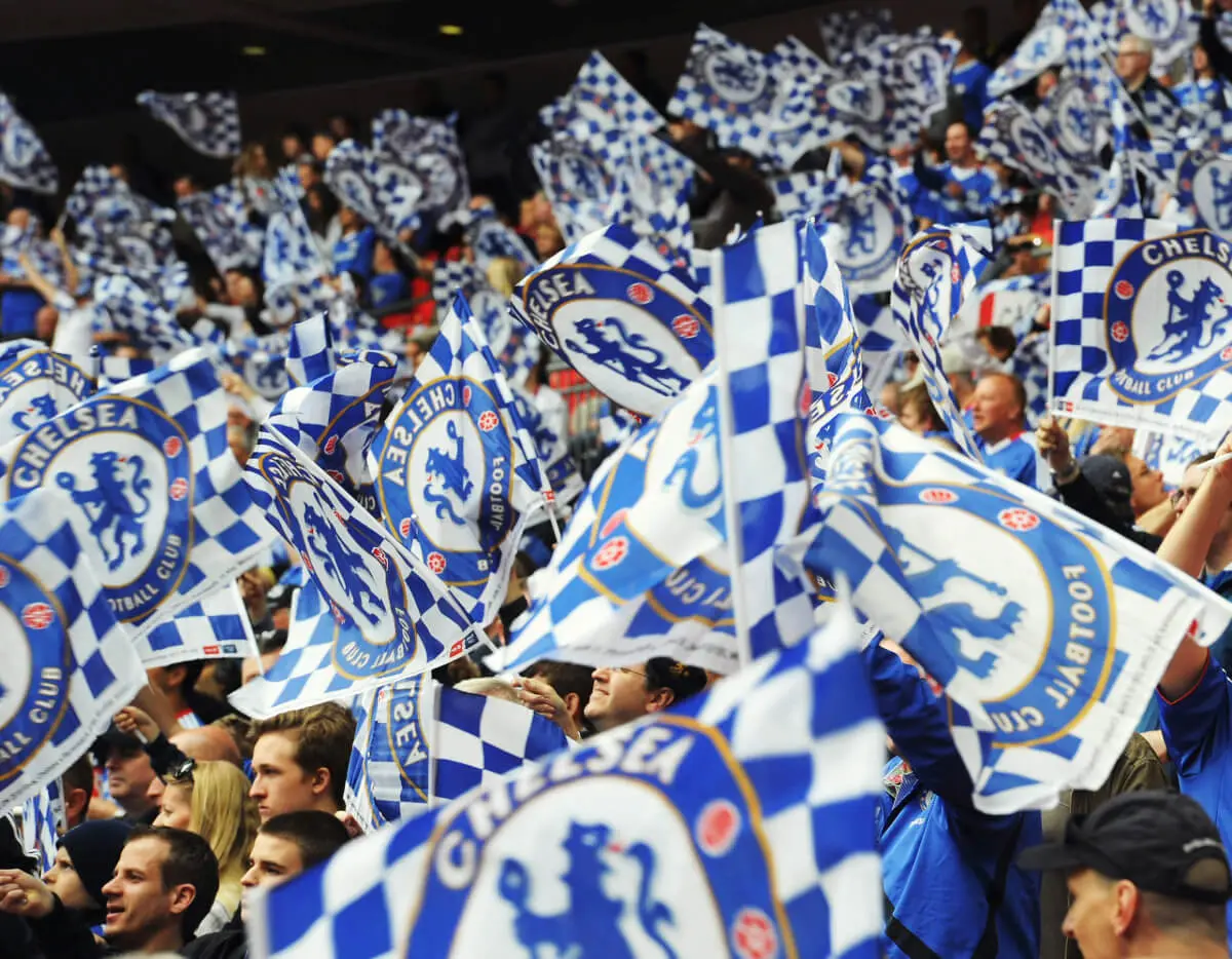 Flags flying at Stamford Bridge with Chelsea FC logos on them.
