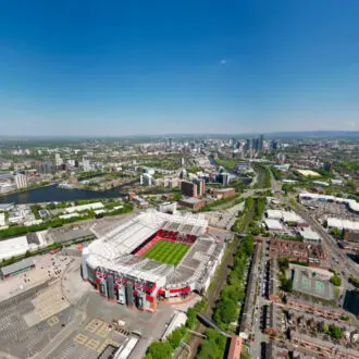 Old Trafford aerial shot in the sunshine.