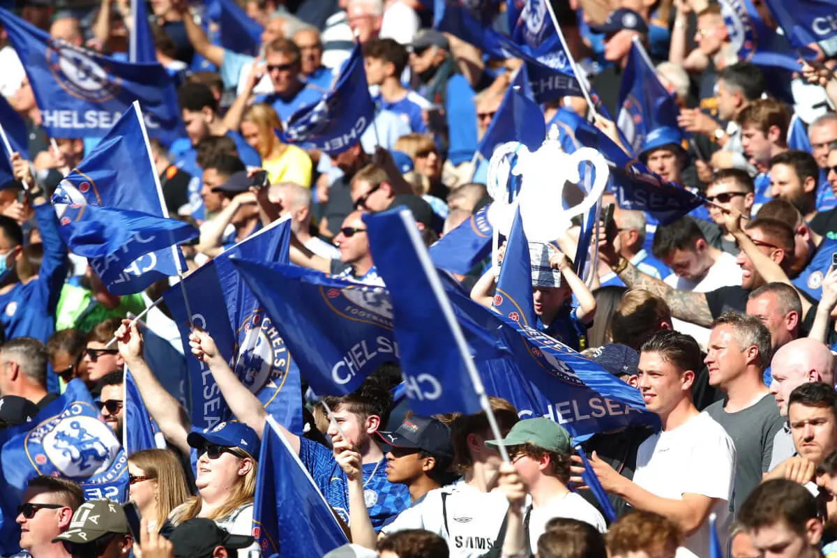 Chelsea FC fans celebrating at Stamford Bridge.