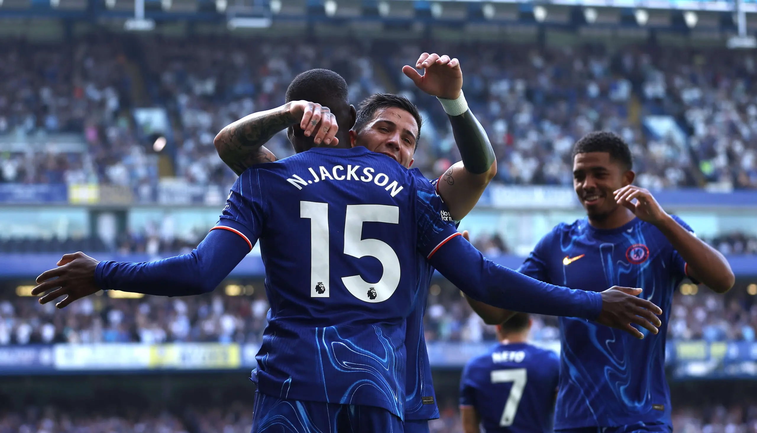 Chelsea FC players celebrating at Stamford Bridge.