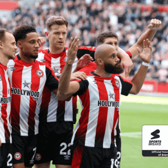 Brentford FC players celebrating a goal.