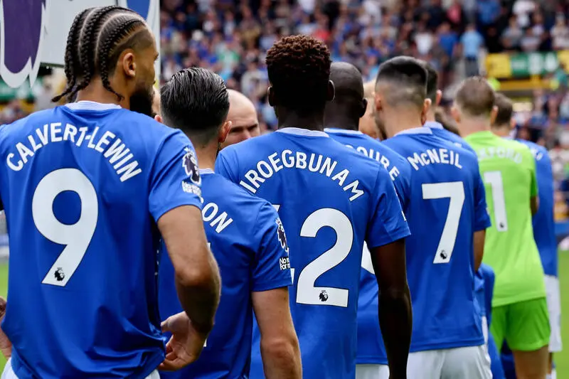 Everton players lining up for the start of a Premier League match.