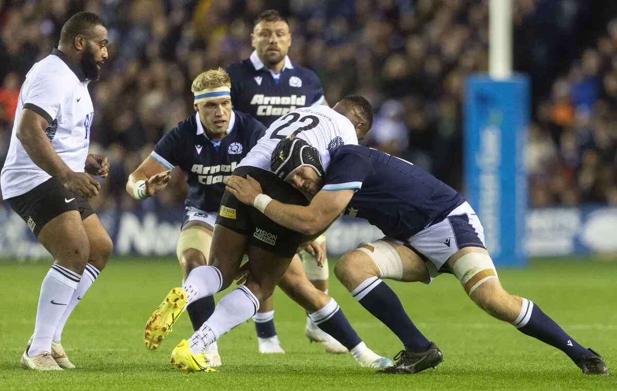 Scottish Rugby players being tackled by Fiji players at Scottish Gas Murrayfield.