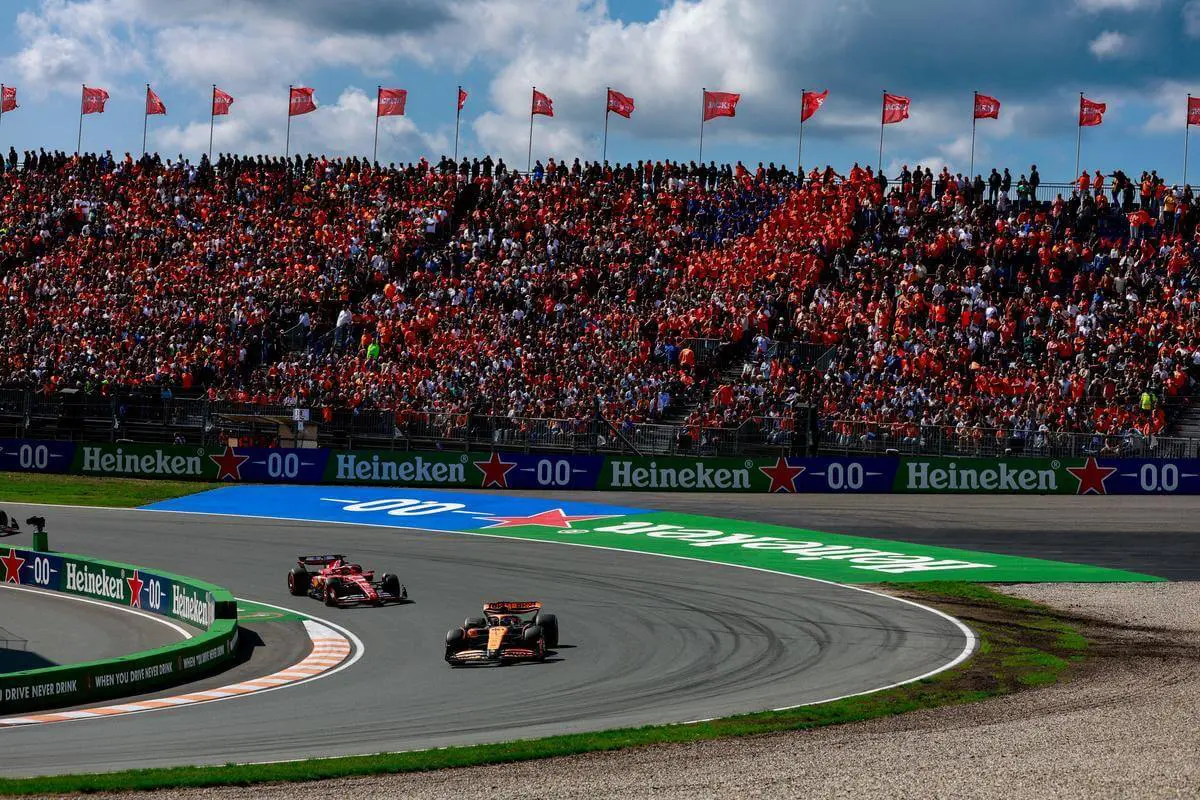 Dutch Grand Prix, McLaren and Ferrari face off next to Grandstand.