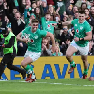 Ireland Rugby player running to score a try.