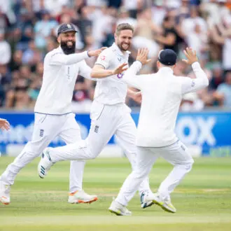 Players celebrating taking a wicket at Headingley Cricket Ground.