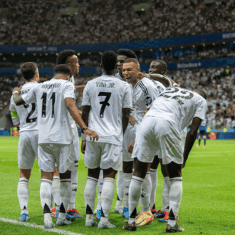 Real Madrid players celebrating together.