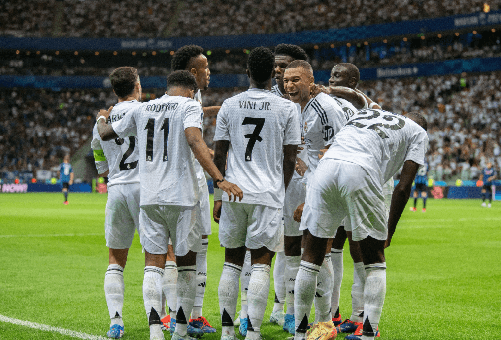 Real Madrid players celebrating together.