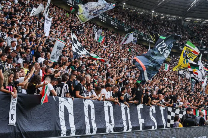Juventus fans celebrate in the stands at the Allianz Stadium, Turin.