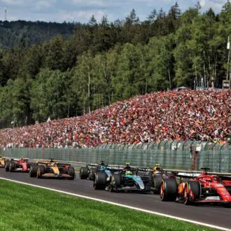 Cars battling it out on the first lap of the Belgian Grand Prix 2024.