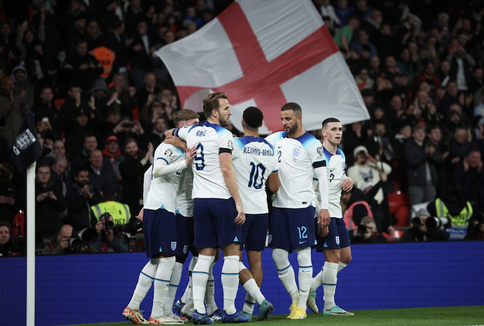 England players celebrating at Wembley Stadium.