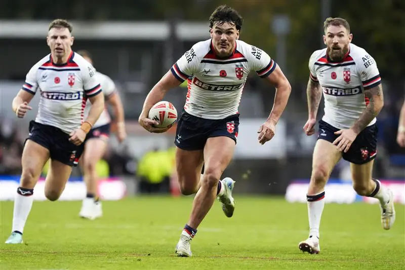 England Rugby League players carry the ball.