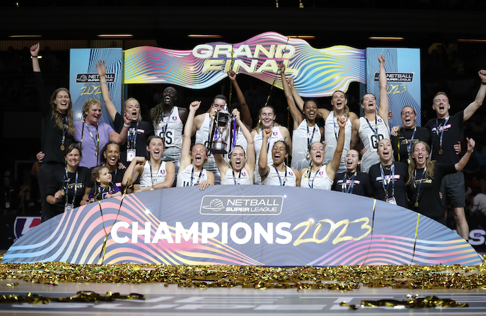 Netball Super League Champions celebrate with the trophy.