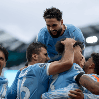 Man City players celebrate on Derby Day