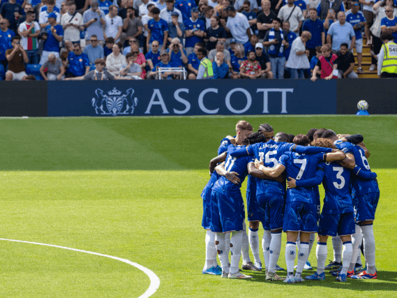 Chelsea FC players in a huddle before kick-of at Stamford Bridge.
