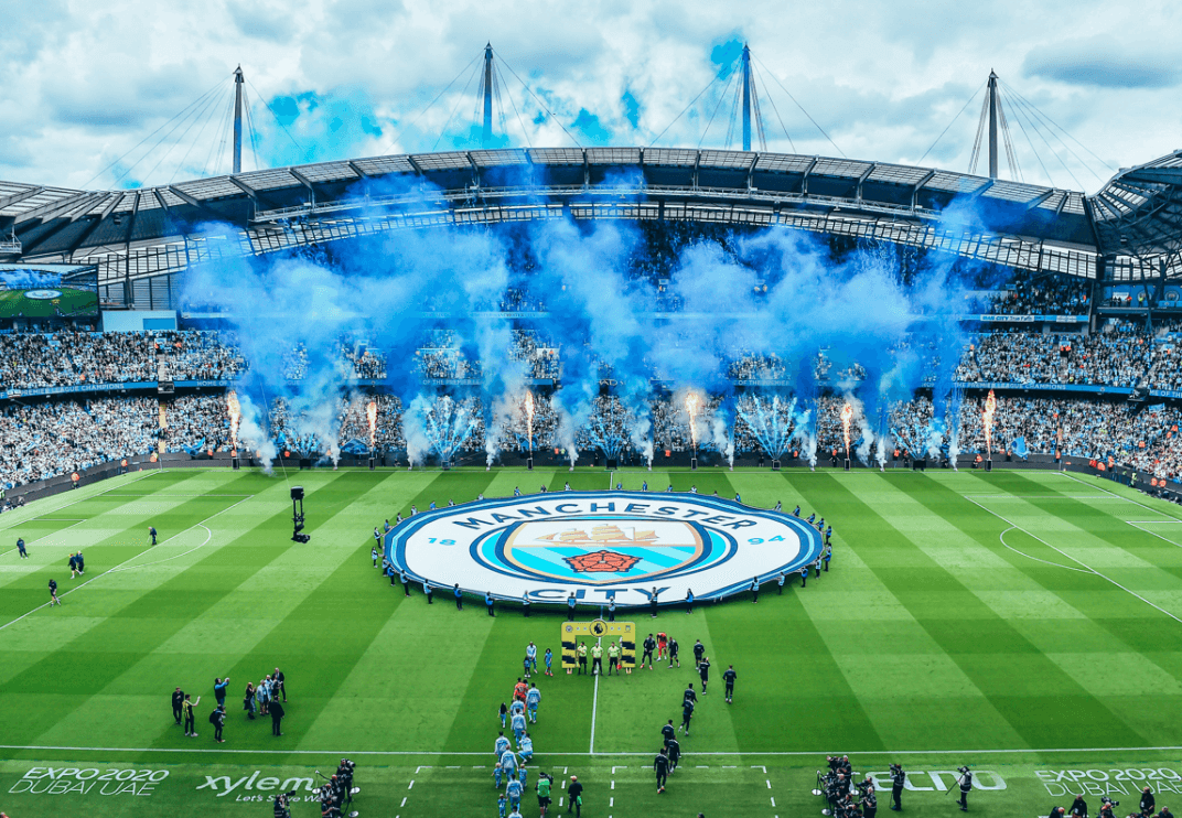 Blue pyrotechnics at Etihad Stadium