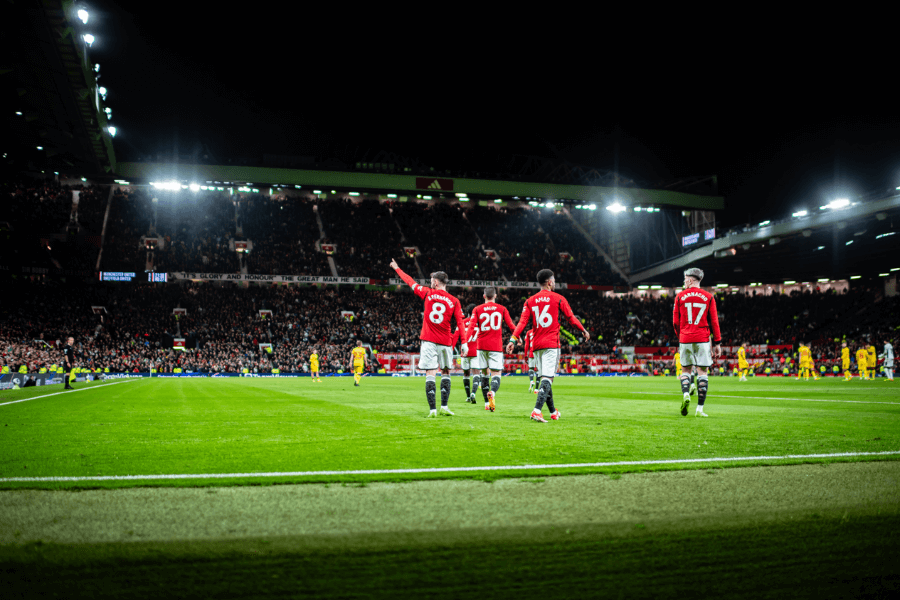 Manchester United players celebrating a goal.