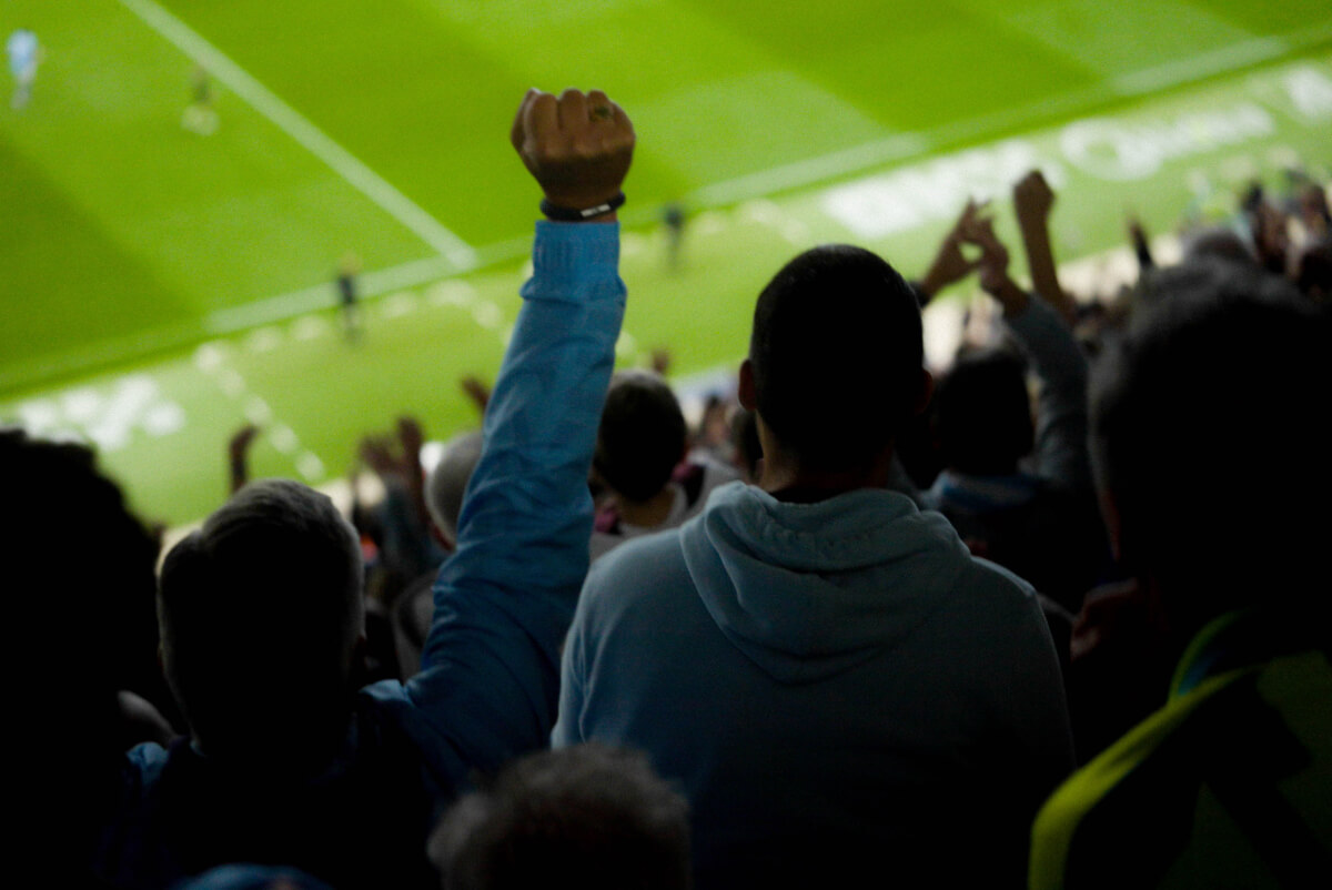 Fans celebrating at the Etihad Stadium.