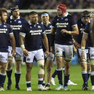 Players in discussion following a try.