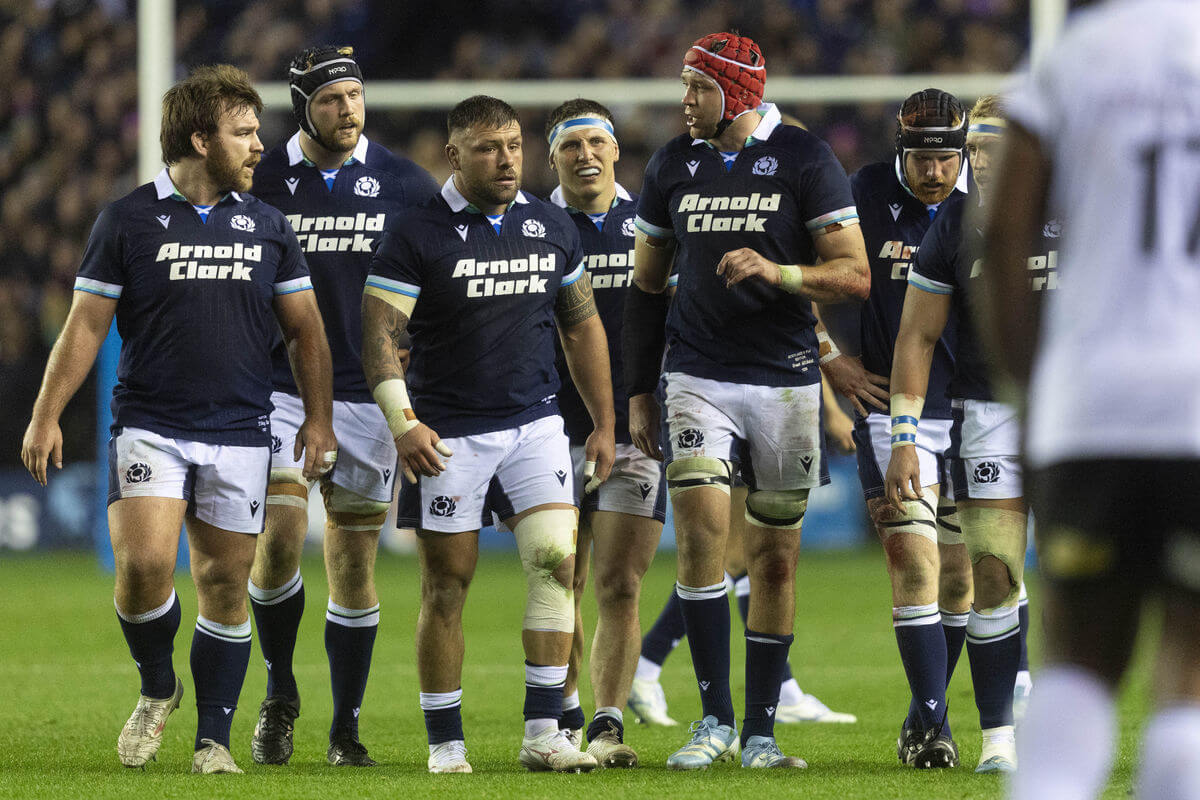 Players in discussion following a try.