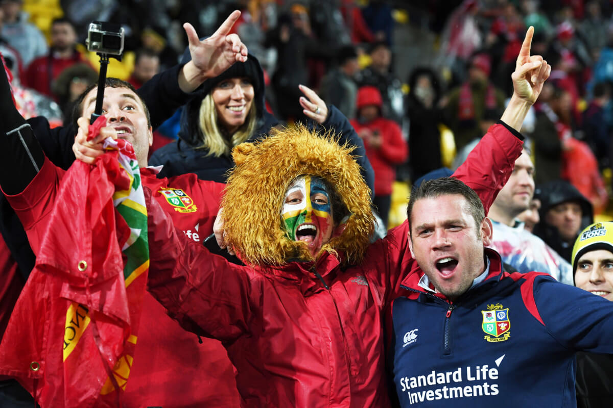 Lions fans celebrating in the stands.