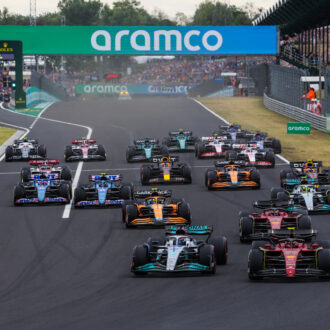 F1 drivers at starting line for Hungarian Grand Prix.
