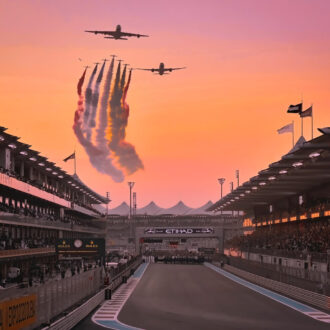 Plane flies over the start line for the Abu Dhabi Grand Prix.
