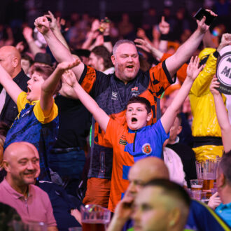 Fans celebrating at Mr Vegas Grand Slam of Darts