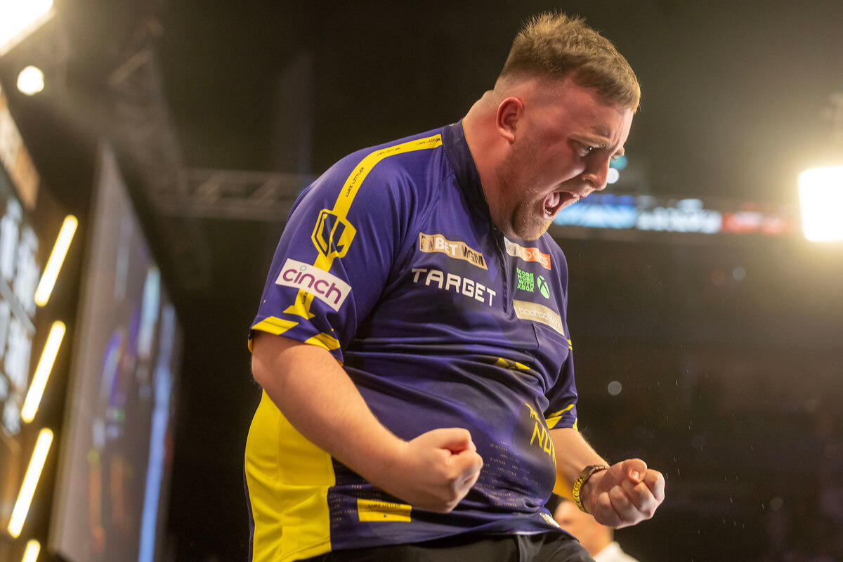 Littler celebrates passionately at the Premier League darts 2025.