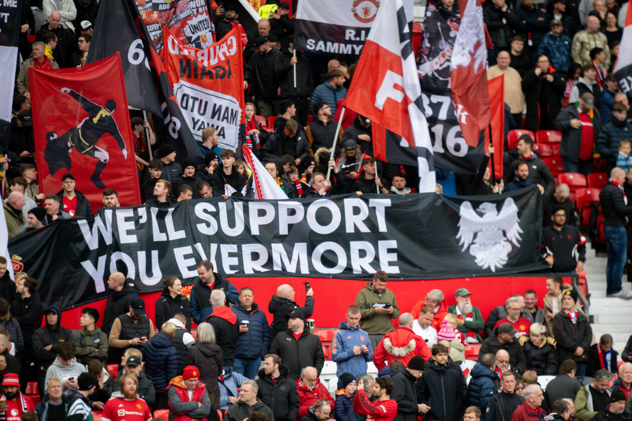 Manchester United fans at Old Trafford with 'We'll support you evermore' banner