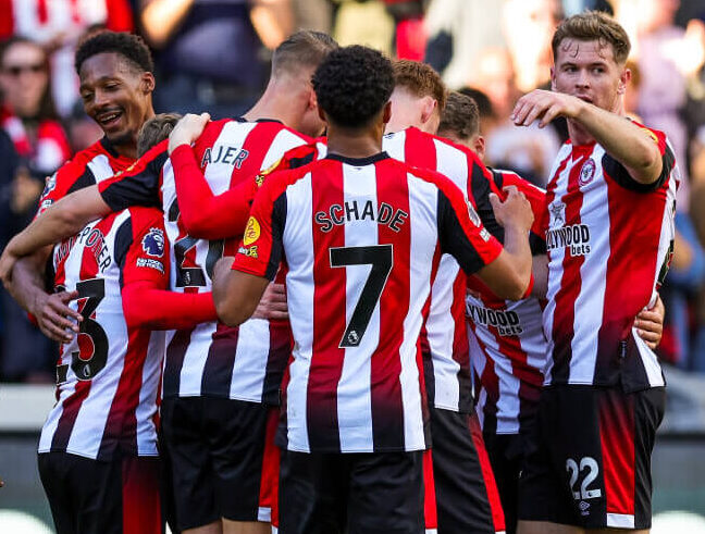 Brentford FC players celebrating following the final whistle.
