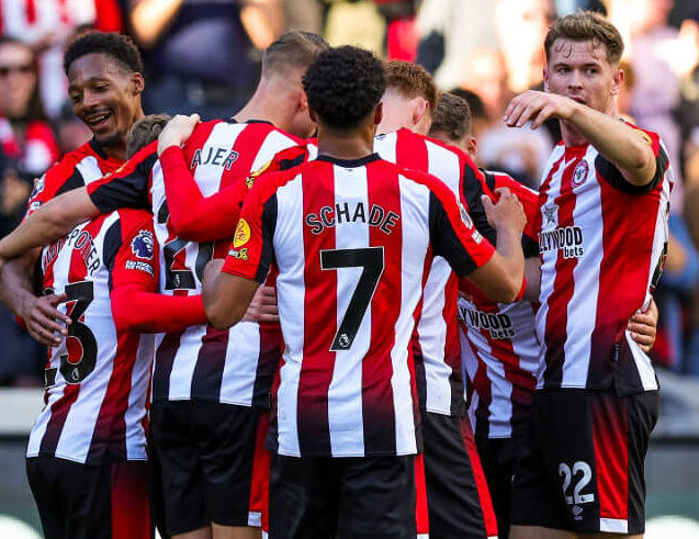 Brentford FC players celebrating following the final whistle.