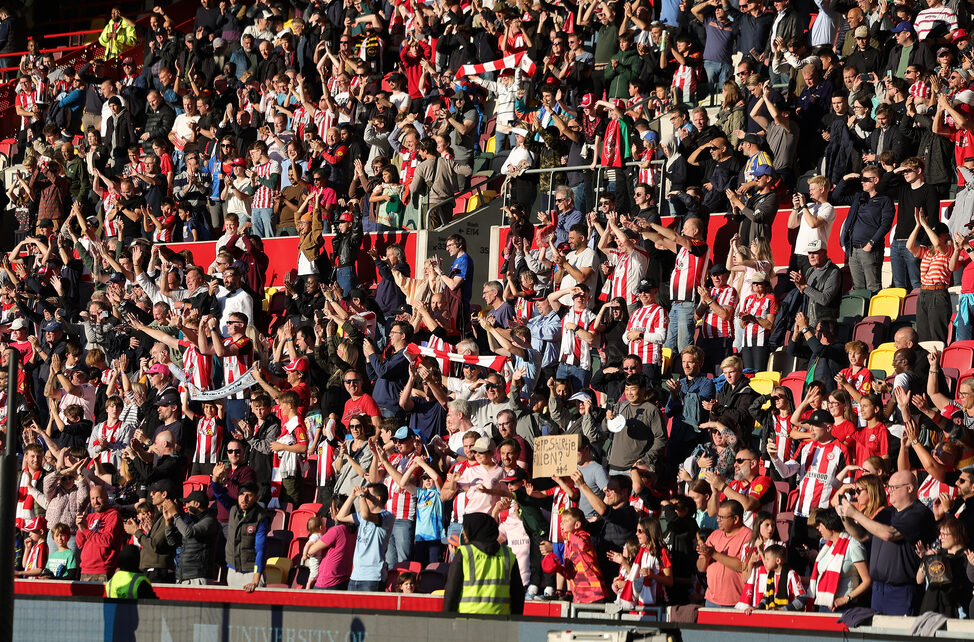 Brentford FC fans celebrating victory over Wolverhampton Wanderers in the Premier League 24/25 season.