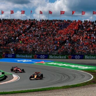 Dutch Grand Prix, McLaren and Ferrari face off next to Grandstand.