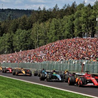 Cars battling it out on the first lap of the Belgian Grand Prix 2024.