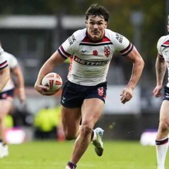 England Rugby League players carry the ball.