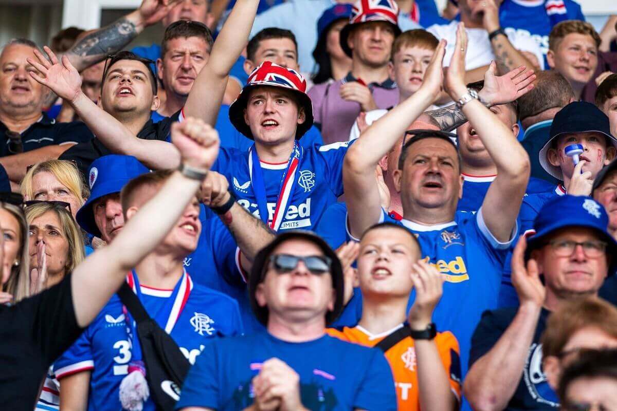 Rangers fans cheering at the Ibrox